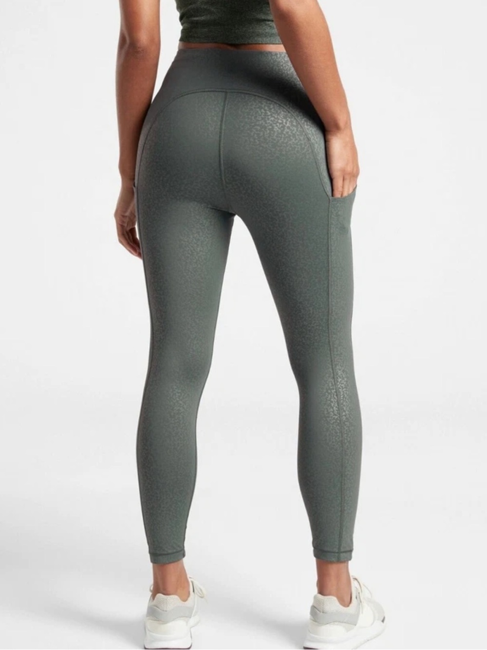 Athleta Ultimate Stash Pocket Embossed 7/8 Tights in a blue leopard print